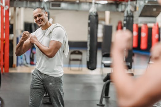 man assessing body changes in mirror