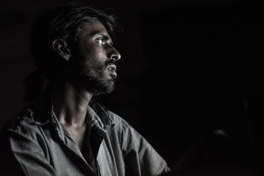 man painting in a quiet studio