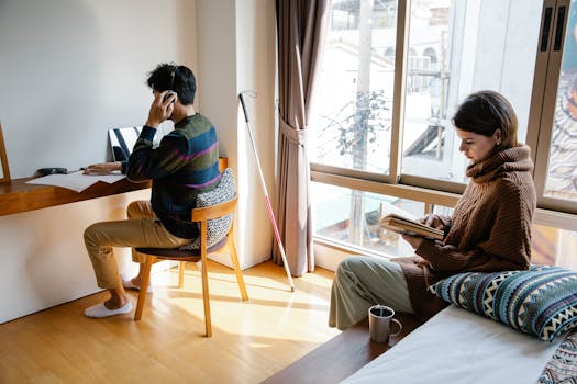 man reading a book in a cozy corner