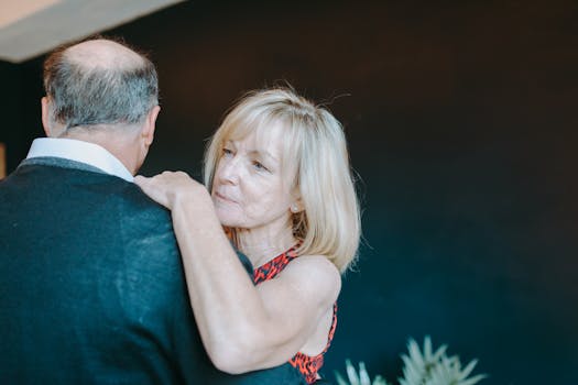 senior couple dancing indoors