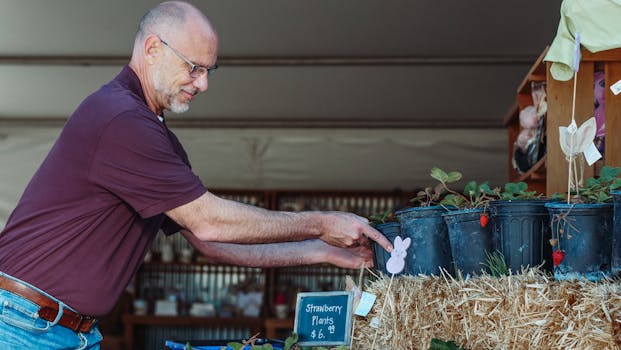 senior man tending to indoor plants