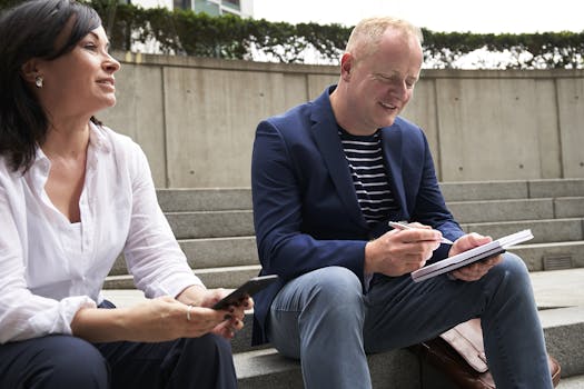 older man writing down goals