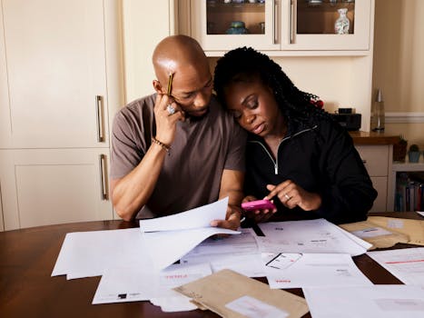 man reviewing financial documents at a table