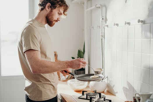 older man cooking in the kitchen