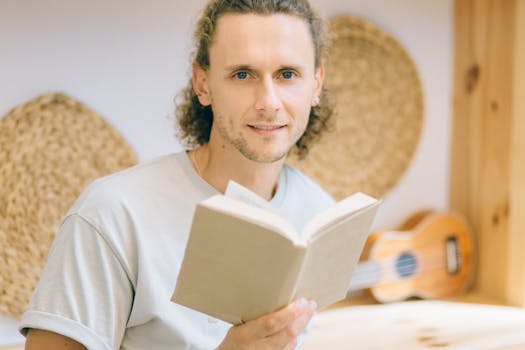 happy older man learning guitar