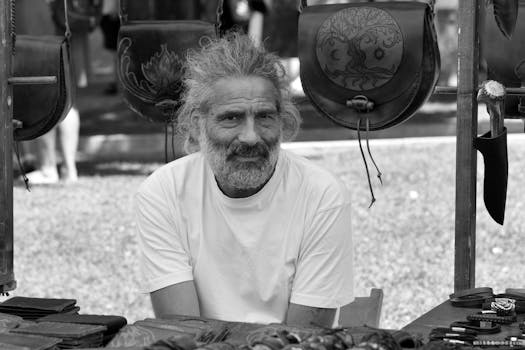 a man selling his handmade crafts at a local market