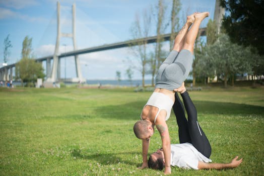 man practicing yoga outdoors