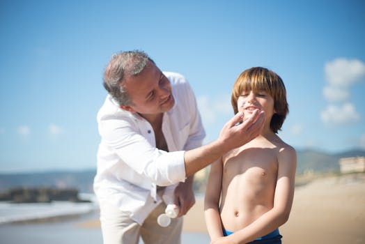 man applying sunscreen