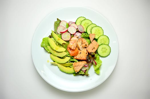 colorful salad with salmon and avocado